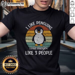 Nice I Like Penguins And Maybe Like 3 People Shirt displayed on a flat lay background