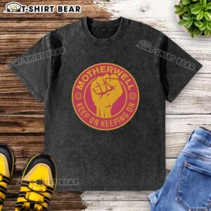Official Motherwell FC 'Keep On Keeping On' T-shirt featuring a raised fist design, perfect for fans and collectors.