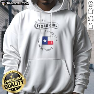 Premium Just A Texas Girl Living In A Wyoming World Texas Flag Hoodie in dark color, front view with bold text and Texas flag design