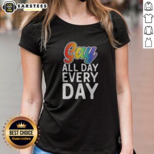Original Gay All Day Every Day ladies shirt in white with bold rainbow text design, displayed on a female model