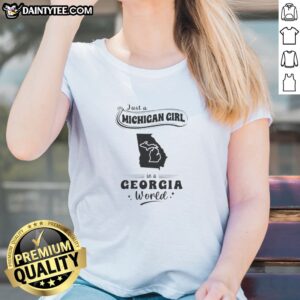 Top Just A Michigan Girl In A Georgia World Ladies Shirt featuring bold text on a comfortable short-sleeve tee