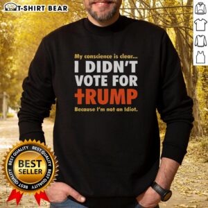 Official Political Conscience sweatshirt in clear orange text: 'I Didn't Vote For Trump Because I'm Not An Idiot.'