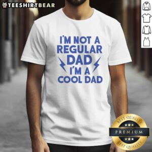 Good I'M Not A Regular Dad I'M A Cool Dad Shirt displayed on a hanger, showcasing its unique design.