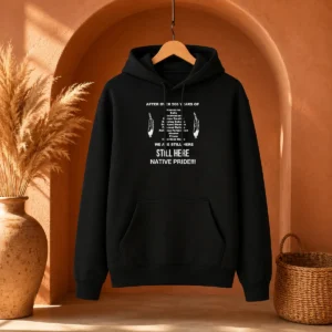 Funny After Over 500 Years Of We Are Still Here Still Here Native Pride Hoodie in black, front view with bold white text design