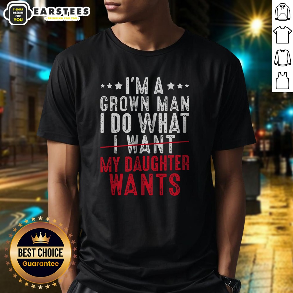 funny-girl-dad-i-m-a-grown-man-i-do-what-my-daughter-wants-shirt-1 Funny Girl Dad I'M A Grown Man I Do What My Daughter Wants shirt displayed on a wooden background
