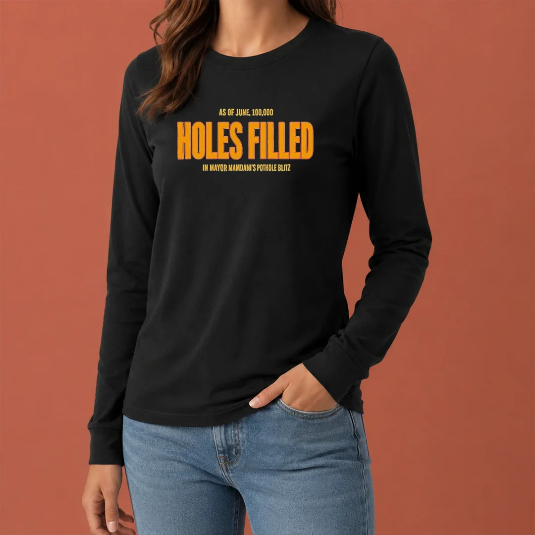 funny-holes-filled-as-of-june-10000-in-mayor-mamdani-s-pothole-blitz-graphic-long-sleeve-shirt Funny Holes Filled As Of June 10000 In Mayor Mamdani'S Pothole Blitz Graphic on a long sleeve shirt, showcasing bold text and vibrant print