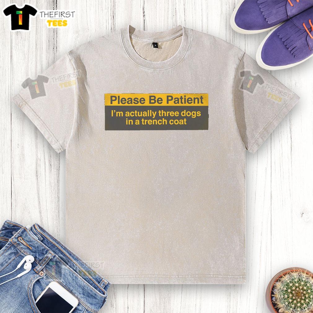 funny-please-be-patient-im-actually-three-dogs-in-a-trench-coat-washed-t-shirt Alt Text: Three dogs in a trench coat humorously posing in a washed t-shirt, showcasing a funny and playful scene.
