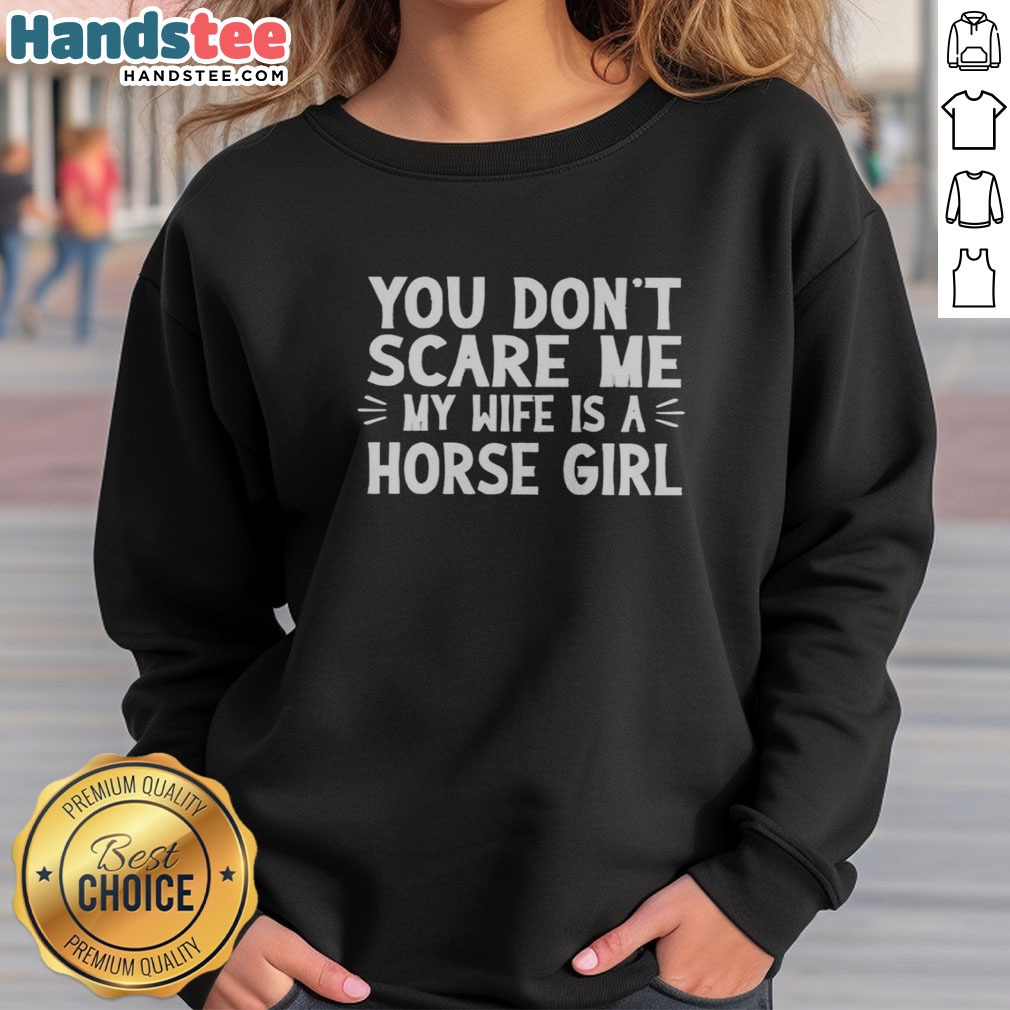 funny-you-dont-scare-me-my-wife-is-a-horse-girl-sweatshirt Funny You Dont Scare Me My Wife Is A Horse Girl sweatshirt displayed on a hanger