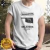 Good Just A Michigan Girl In An Oklahoma World graphic t-shirt with bold white text on black cotton fabric