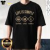 Good Life Is Simple Coffee Cats Books Graphic Novelty Casual Cotton Shirt displayed flat on a wooden surface.