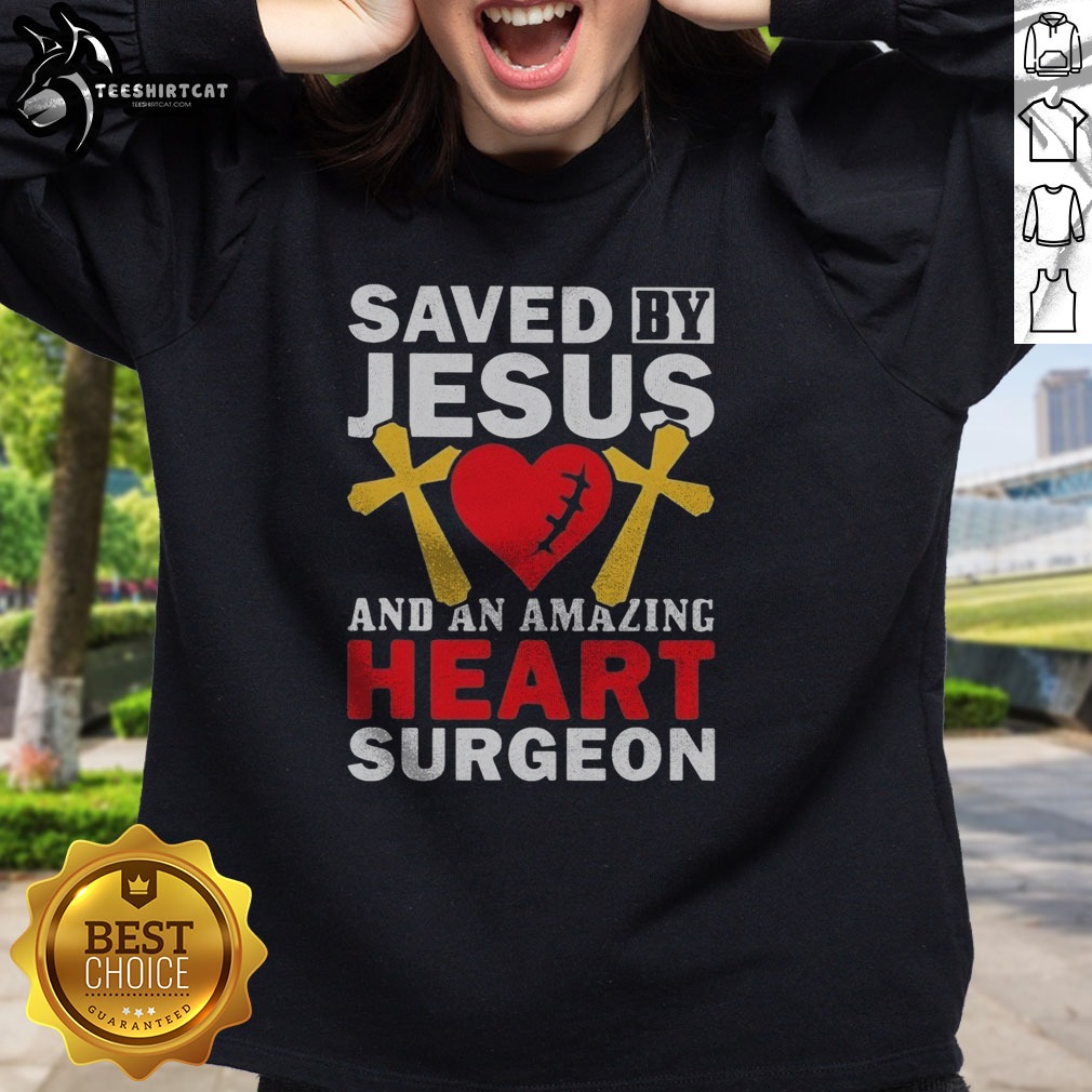 good-saved-by-jesus-and-an-amazing-heart-surgeon-sweatshirt Good Saved By Jesus And An Amazing Heart Surgeon Sweatshirt featuring a bold graphic design.
