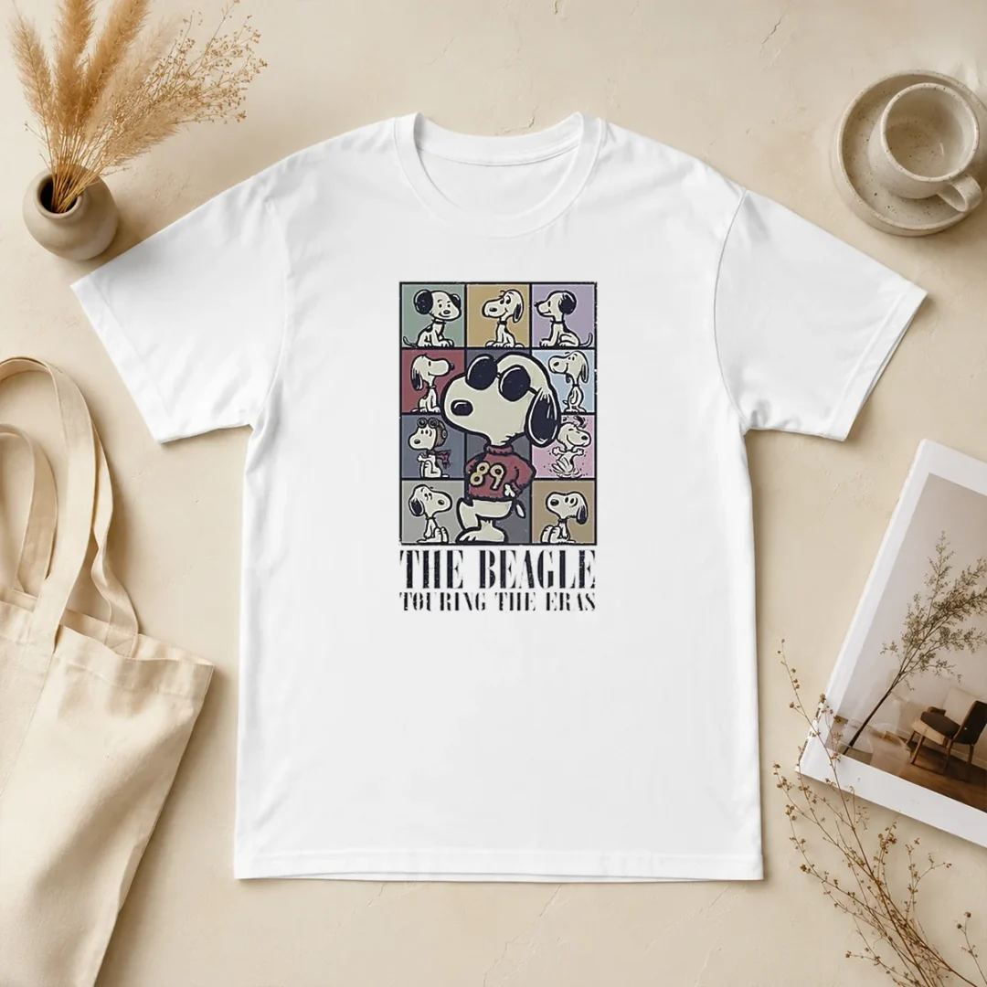 Hot Snoopy Peanuts The Beagle Touring The Eras Cartoon T Shirt Hot Snoopy Peanuts The Beagle Touring The Eras Cartoon t shirt featuring classic Snoopy graphic on a comfortable short sleeve tee