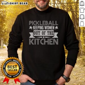 Funny Pickleball Keeping Women Out Of The Kitchen Sweatshirt in a cozy setting, showcasing humor and comfort.