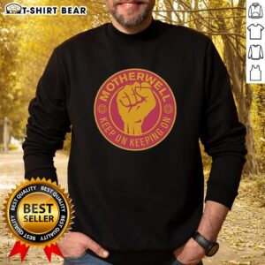 Official Motherwell FC Keep On Keeping On sweatshirt featuring a raised fist design, perfect for fans and casual wear.