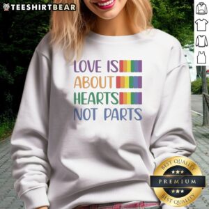 Original Love Is About Hearts Not Parts Pride Month Sweatshirt in vibrant colors, perfect for celebrating pride.