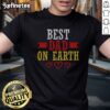Official Best Dad On Earth t shirt displayed on a wooden background
