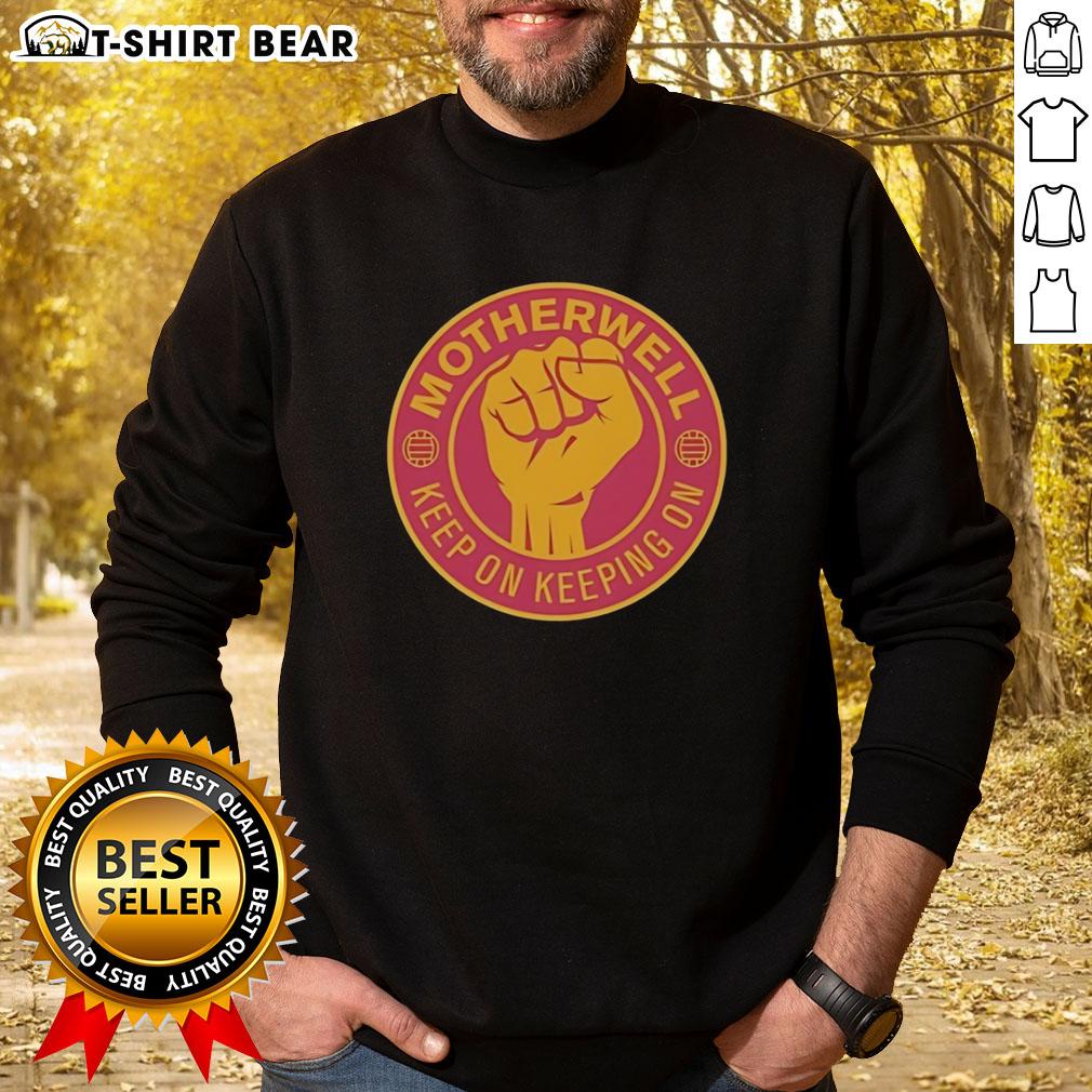 Official Motherwell Fc Keep On Keeping On Raised Fist Sweatshirt Official Motherwell FC Keep On Keeping On sweatshirt featuring a raised fist design, perfect for fans and casual wear.