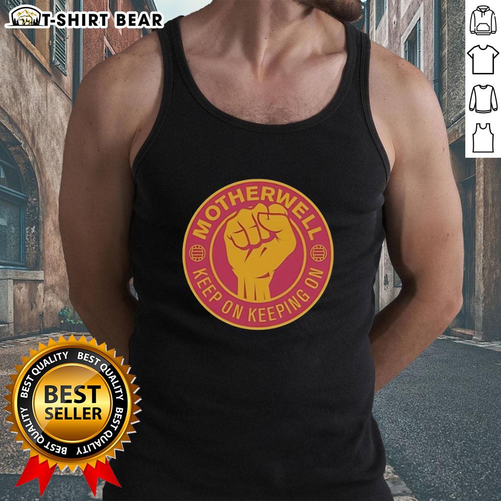 Official Motherwell Fc Keep On Keeping On Raised Fist Tank Top Official Motherwell FC Keep On Keeping On raised fist tank top in gold and maroon, celebrating team spirit and unity.