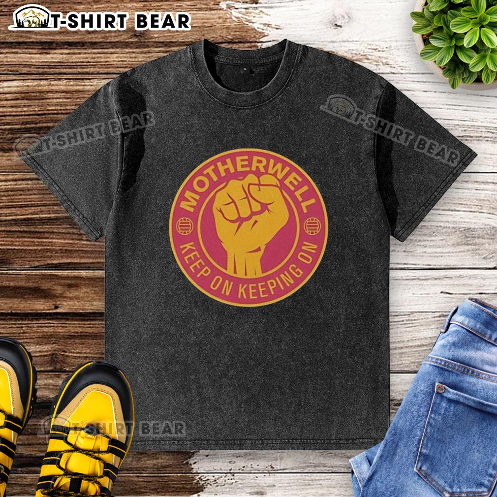 Official Motherwell Fc Keep On Keeping On Raised Fist Washed T Shirt Official Motherwell FC 'Keep On Keeping On' T-shirt featuring a raised fist design, perfect for fans and collectors.