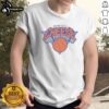 Official New York Knicks Bacon Egg N Cheese Shirt displayed on a hanger against a vibrant background.