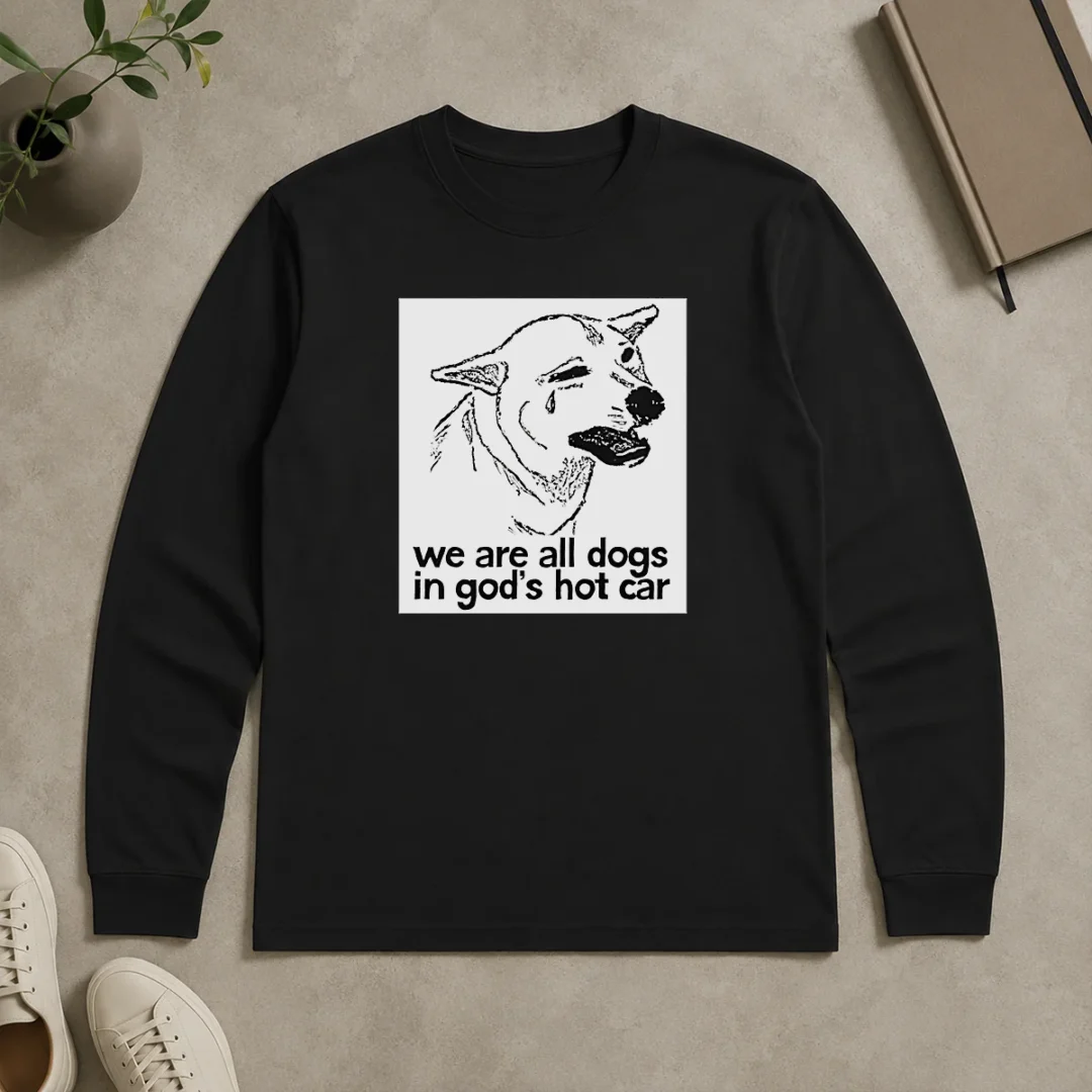 Original We Are All Dogs In Gods Hot Car Long Sleeve Shirt Original We Are All Dogs In Gods Hot Car long sleeve shirt showing front design on a casual fit cotton garment