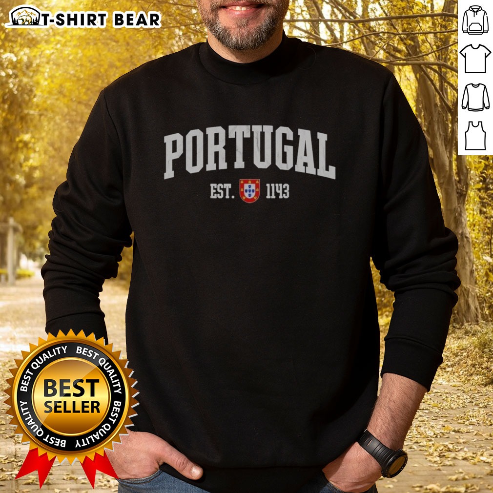 Pretty Portugal Est 1143 Shield Crest Vintage Distressed Style Graphic Sweatshirt Pretty Portugal Est 1143 Shield Crest Vintage Distressed Style Graphic Sweatshirt in a cozy setting.