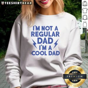 Good I'M Not A Regular Dad I'M A Cool Dad Sweatshirt displayed on a hanger, showcasing its comfortable fit.