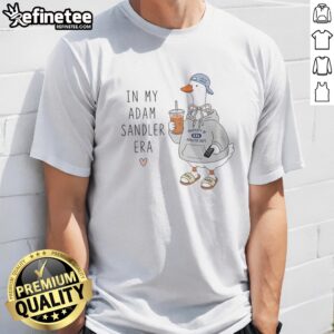 Pretty Goose Wearing Hoodie And Holding Remote Life'S A Garden In My Adam Sandler Era Funny t shirt displayed on a hanger