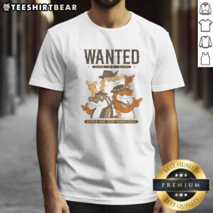 Official Alligator Cowboy Trio Wanted Dead Or Alive Armed And Very Dangerous Shirt displayed on a wooden background