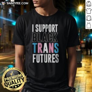 Pretty I Support Black Trans Futures Shirt displayed on a flat surface, showcasing its vibrant colors and message.