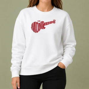 Top The Monkees Guitar Logo Sweater in dark color showing front design and comfortable fit
