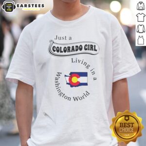 Original Just A Colorado Girl Living In A Washington World shirt displayed on a hanger in a bright setting