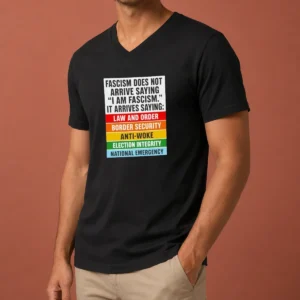Original Fascism Does Not Arrive Saying I Am Fascism It Arrives Saying Law And Order V-Neck Shirt