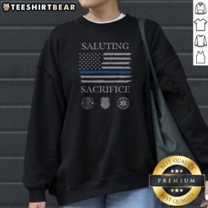 Saluting Sacrifice Fire Dept Police Emergency Medical Services Sweatshirt in black, featuring bold tribute text on front