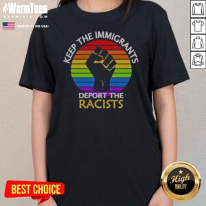 Awesome Keep Immigrants Deport Racists Raised Fist Rainbow Flag Solidarity ladies tee displayed on a wooden background