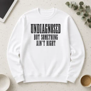 Top Undiagnosed But Something Ain't Right Chronic Illness long sleeve shirt in black, front view with clear text design