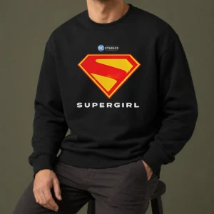 Awesome Supergirl DC Studios Logo Sweater in charcoal gray, featuring a bold graphic on the front
