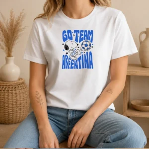 Awesome Snoopy Go Team Argentina World Cup 2026 t shirt featuring Snoopy in Argentina colors on a white cotton tee