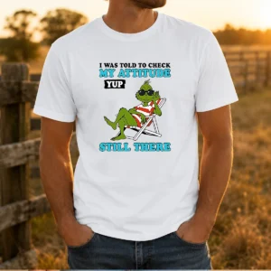 Pretty Grinch I Was Told To Check My Attitude Yup Still There t shirt with bold text graphic on front