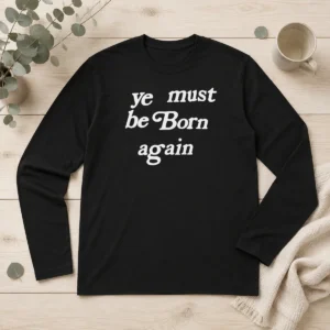 Premium Pharrell Williams Ye Must Be Born Again long sleeve shirt in black, front view with clear logo and text