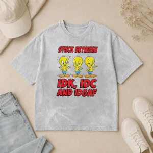 Pretty Tweety Stuck Between IDK IDC And IDGAF Washed T Shirt in soft cotton with faded vintage look
