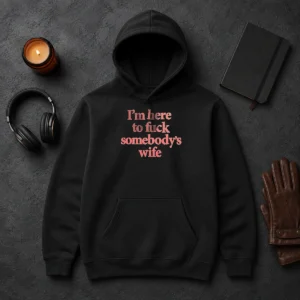 Hot I'M Here To Fuck Somebody'S Wife Hoodie in black, featuring bold white text on front, cozy pullover style with front pocket