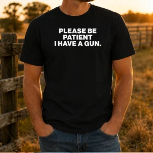Pretty Please Be Patient I Have A Gun Quote t shirt in black, short sleeve cotton tee with bold white text