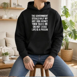 Good The Government Steals Half My Hot Dog Money Life Is A Prison Hoodie in black, featuring bold white text on front