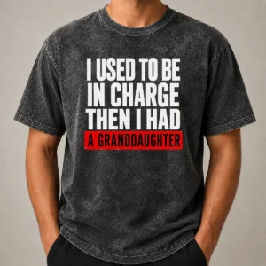 Funny I Used To Be In Charge Then I Had A Granddaughter printed on a soft washed t shirt in light grey