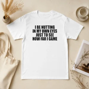 Awesome I Be Nutting In My Own Eyes Just To See How Far I Game t shirt in black, front view with bold text design