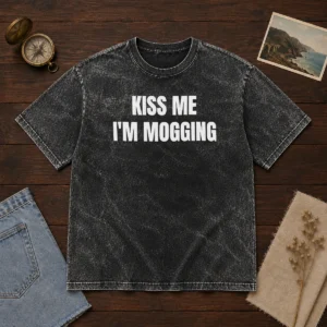 Hot Kiss Me I'M Mogging Looksmaxxing Meme printed on a soft washed cotton t shirt in light grey