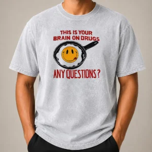Awesome This Is Your Brain On Drugs Any Questions Fried Egg Smiley Face Washed T Shirt showing front print on soft cotton fabric