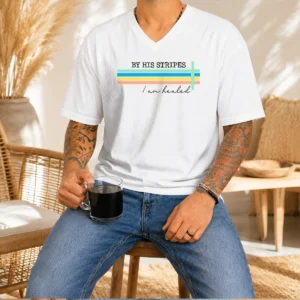 Premium By His Striped I Am Healed Jesus Faith V Neck Shirt in white with black stripes, featuring a comfortable V neckline