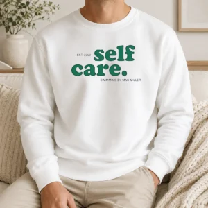 Official Self Care EST 2009 Swimming By Mac Miller Sweater in black with front graphic print, long sleeves, and crew neck